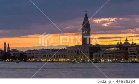 View of the Doge's Palace and the Campanile of St. Mark's Cathedral day to night timelapse. Venice, Italy 44688234