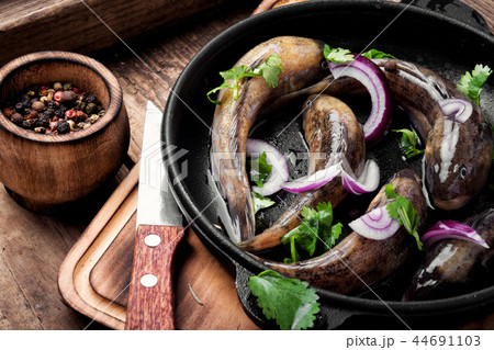 Raw fish in the pan 44691103