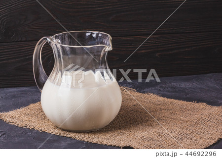Milk in a glass jar with a copy space Milk in a glass jar with a copy space 44692296