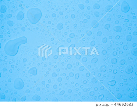 fresh background of water drops on blue surface 44692632