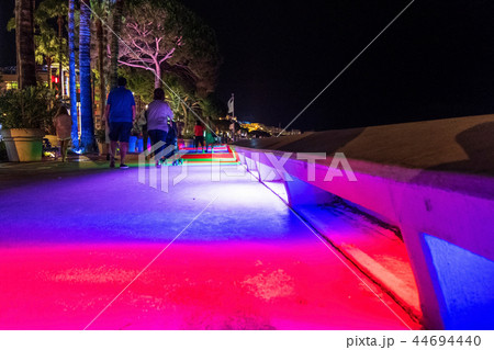 People walking on the rainbow roads of Cannes People walking on the rainbow roads of Cannes 44694440