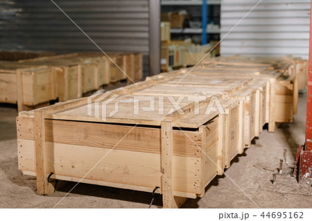 Large wooden boxes. Warehouse of spare parts for machines and mechanisms. Production of ventilation 44695162