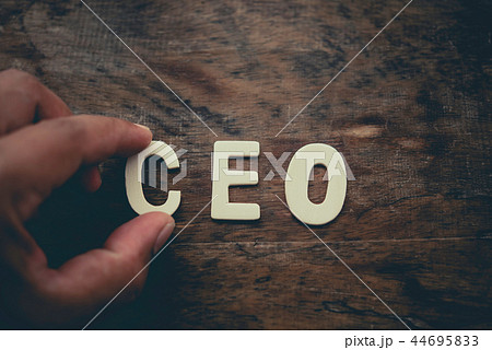 Place the word "CEO" white on the wooden floor. Place the word "CEO" white on the wooden floor. 44695833