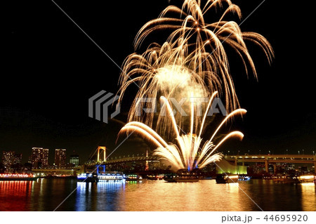 お台場の冬花火とレインボーブリッジと東京タワーの写真素材