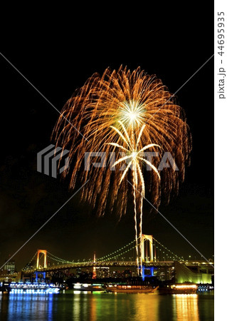 お台場の冬花火とレインボーブリッジと東京タワーの写真素材