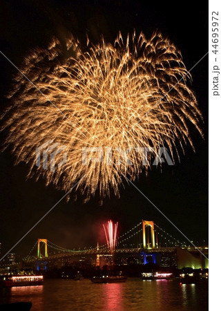 お台場の冬花火とレインボーブリッジと東京タワーの写真素材