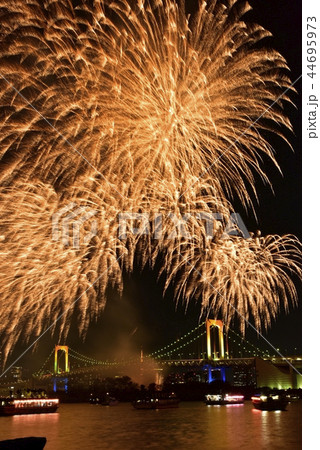 お台場の冬花火とレインボーブリッジと東京タワーの写真素材