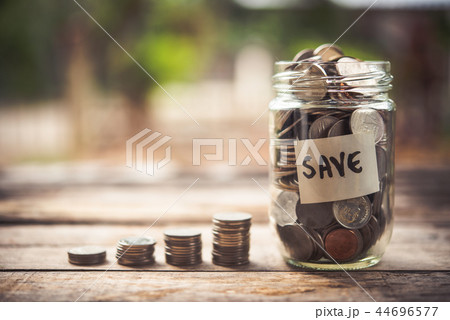Coins in glass jar for money saving Investment Coins in glass jar for money saving Investment 44696577