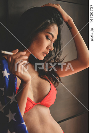 Smoking concept. Sexy women are smoking in the room. Sexy women 44700757