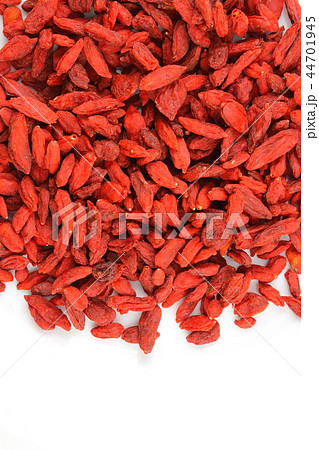dried goji berries on a white plate copy space 44701945
