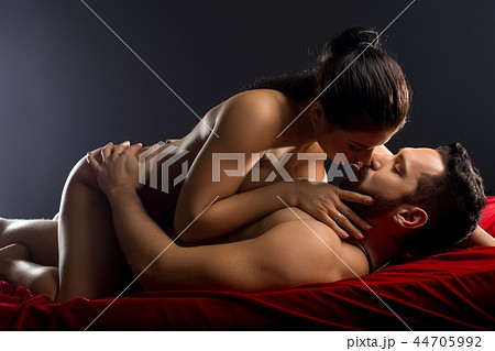 Loving couple in a steamy embrace in bed shot Loving couple in a steamy embrace in bed shot 44705992