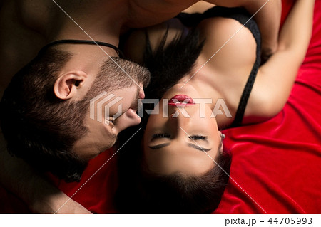 Loving man and woman in bed high angle shot 44705993