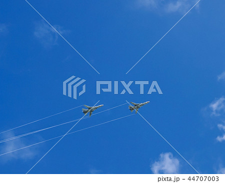 Two military aircraft flying in the blue sky  44707003