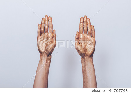 Woman's both hands painted golden sequins showing Woman's both hands painted golden sequins showing 44707793