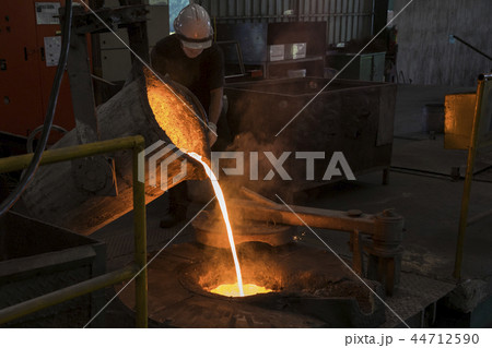 Molten iron pour from ladle into melting furnace Molten iron pour from ladle into melting furnace 44712590