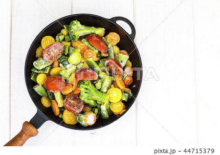 Frying pan with frozen vegetables Frying pan with frozen vegetables 44715379