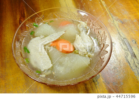 boiled winter melon with chicken wing and leg soup 44715596