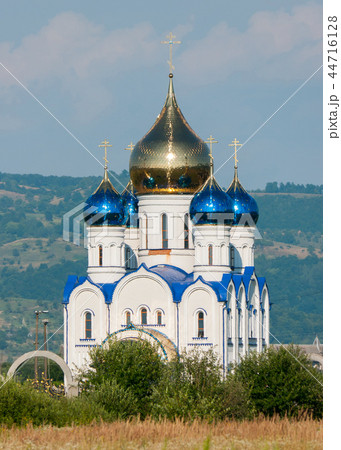 rural church with blue roof and domes with crosses rural church with blue roof and domes with crosses 44716128