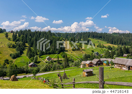 Beautiful countryside with neat rural houses stand Beautiful countryside with neat rural houses stand 44716143
