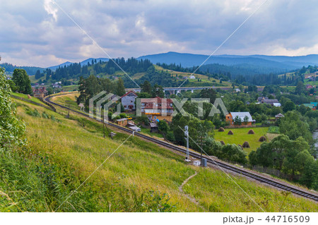 The railway passes between the mountain slopes alo The railway passes between the mountain slopes alo 44716509