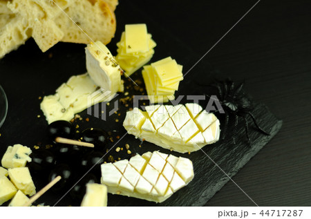 A set of cheeses served in a special form  44717287