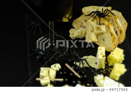 A set of cheeses served in a special form 44717303