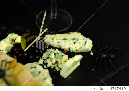 A set of cheeses served in a special form A set of cheeses served in a special form 44717419