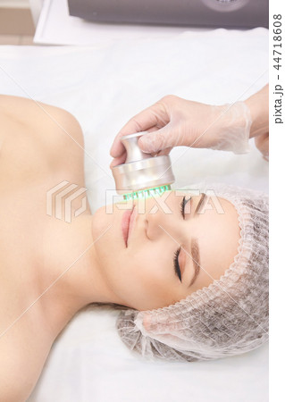 Woman cosmetology procedure. Light face Medical  44718608