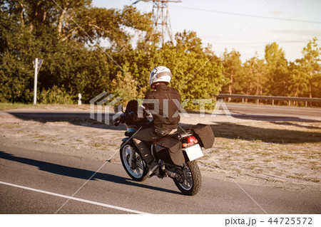 Back view of a motorcyclist 44725572