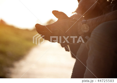 Putting on the gloves to drive a bike Putting on the gloves to drive a bike 44725583