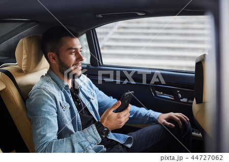 handsome cheerful guy organizing every minute. 44727062