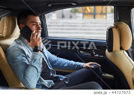 serious pleasant businessman making a phone call serious pleasant businessman making a phone call 44727072