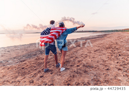 american couple with hand flare or fusee american couple with hand flare or fusee 44729435