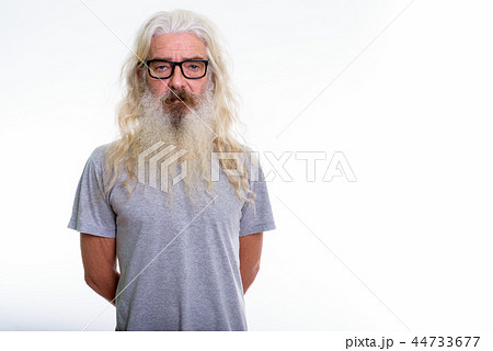 Studio shot of senior bearded man wearing eyeglasses  44733677