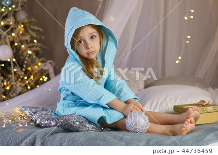 Little girl in bathrobe. Christmas Little girl in bathrobe. Christmas 44736459