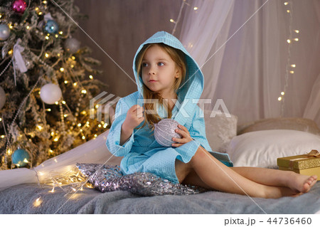 Little girl in bathrobe. Christmas 44736460