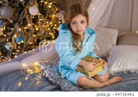 Little girl in bathrobe. Christmas 44736461