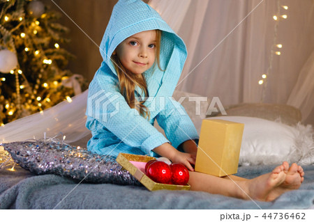 Little girl in bathrobe. Christmas 44736462