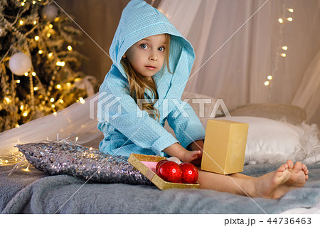 Little girl in bathrobe. Christmas 44736463