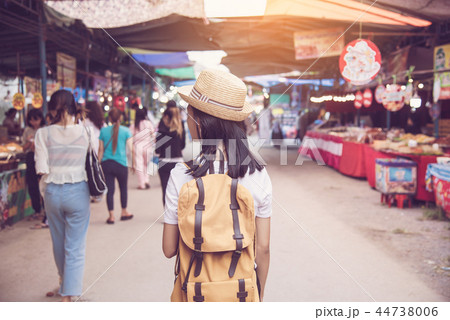 Teenagers backpacking along the market Teenagers backpacking along the market 44738006
