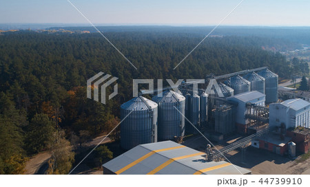 Metal grain elevator inagricultural zone in forest Metal grain elevator inagricultural zone in forest 44739910