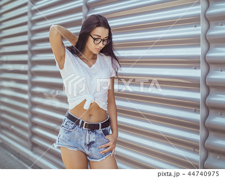 Casual summer retro look. Attractive girl outdoor 44740975