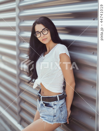 Casual summer retro look. Attractive girl outdoor 44741019