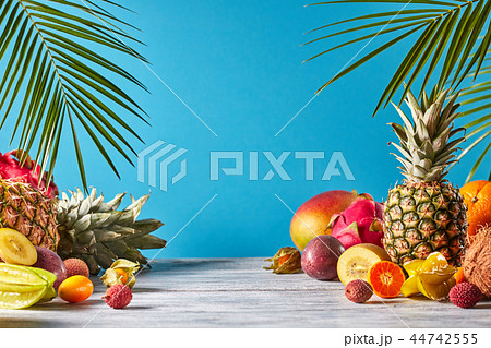 Pineapple, mango, dragon fruit, passion fruit, coconut, carambola, kumquat - frame of exotic fruits 44742555