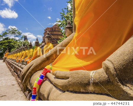 Row of Buddha statues in Ayutthaya, Thailand  44744231