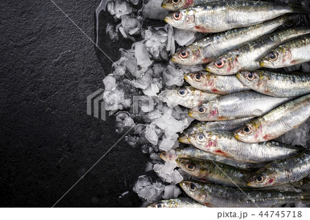 Raw sardine on ice offered Raw sardine on ice offered 44745718