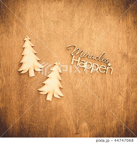 Inscription miracles happen on a wooden background 44747068
