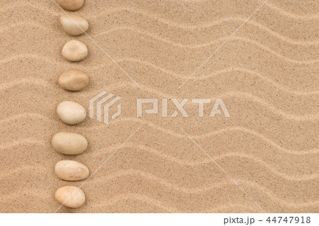 Line made of white stones among sand dunes. 44747918