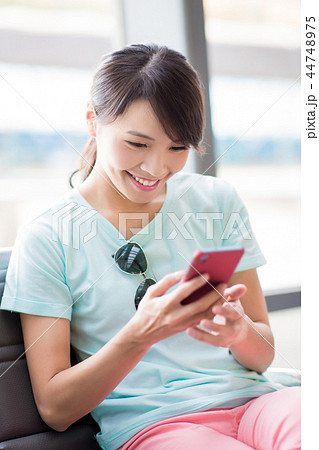 woman use phone happily 44748975