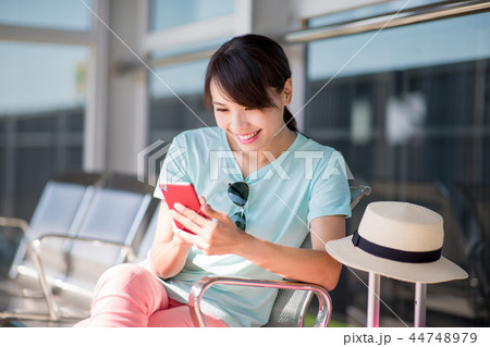 woman use phone happily 44748979